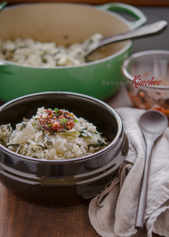 Brown rice is cooked with Swiss chard together and serve with chili topping sauce