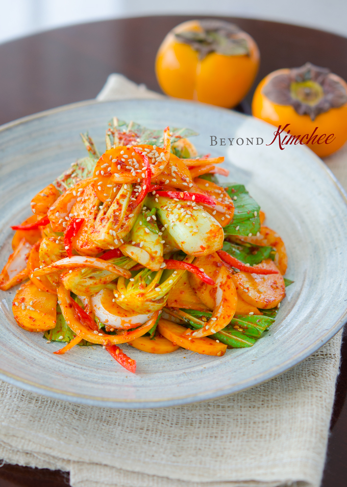 Bok choy persimmon salad garnished with sesame seeds