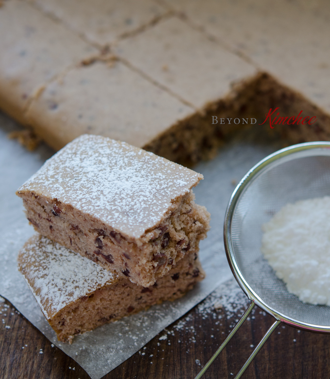 Red Bean Rice Cake is sliced and dusted with powdered sugar.