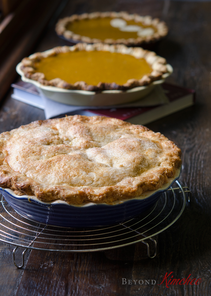 This American classic deep dish apple pie is cooling on a rack.
