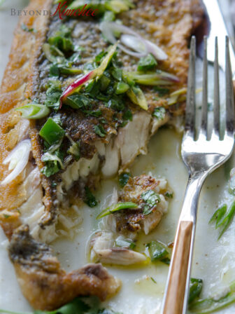Mexican style grilled fish is topped with cilantro green onion sauce