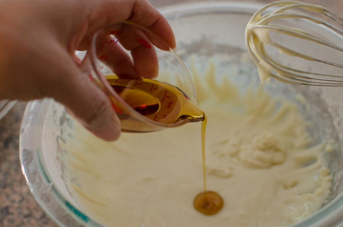 Maple syrup is added to whipped cream cheese.