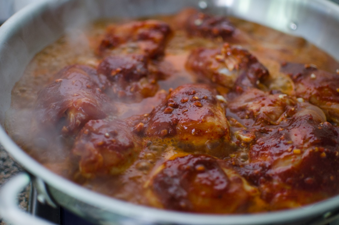 Spicy Korean chicken stew simmering in a pan.