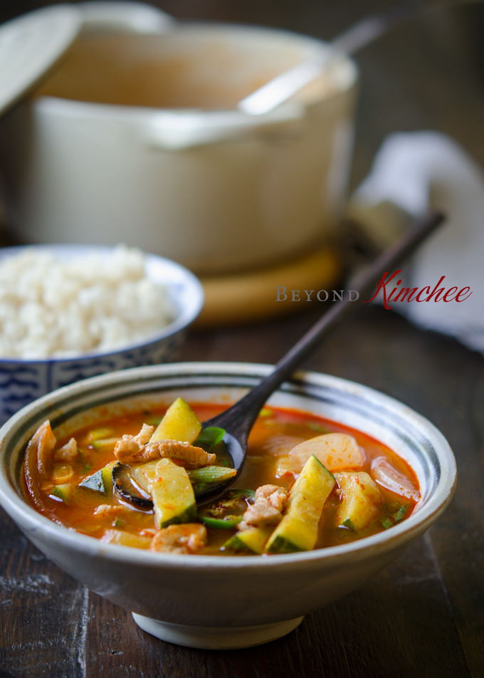 Pork and zucchini are simmered in spicy broth in this Korean stew