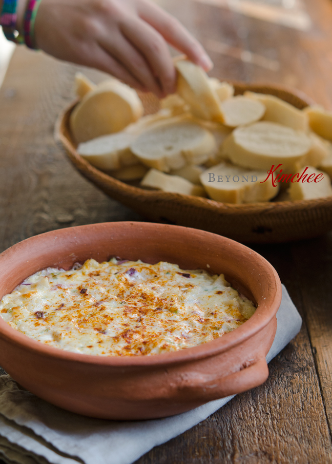 Warm hearts of palm dip is served with mini baguette slices.