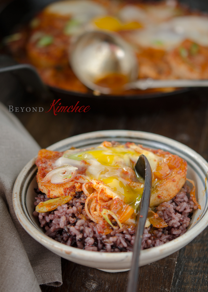 Korean spicy tofu and egg is served with mixed grain rice.