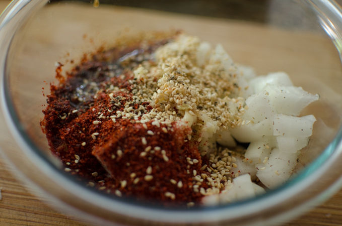 Seasoning sauce for tofu dish is mixed in a bowl.