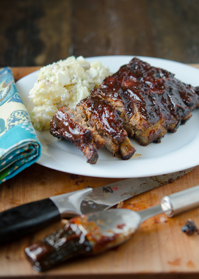 Best homemade BBQ Pork Ribs are served with potato salad