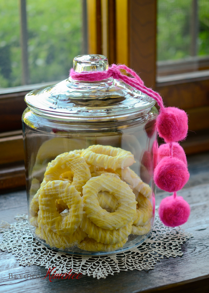 Lemon Jumbles (Lemon ring cookies) are stored in a cookie jar.