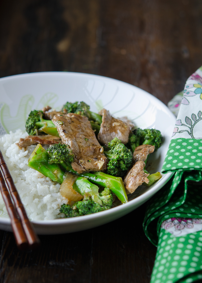 Beef broccoli stir-fry is served with rice in a bowl as a rice bowl dish.