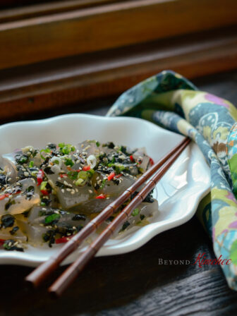 Korean mung bean gelatin with soy sauce vinaigrette and crumbled seaweed.