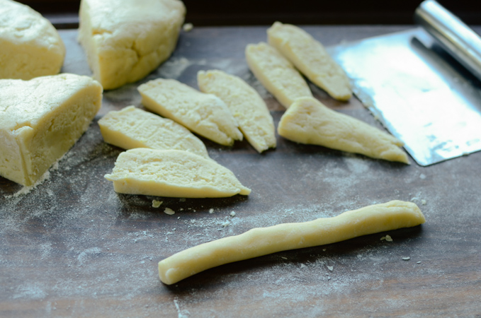 Lemon jumble cookie dough made into a long rope.