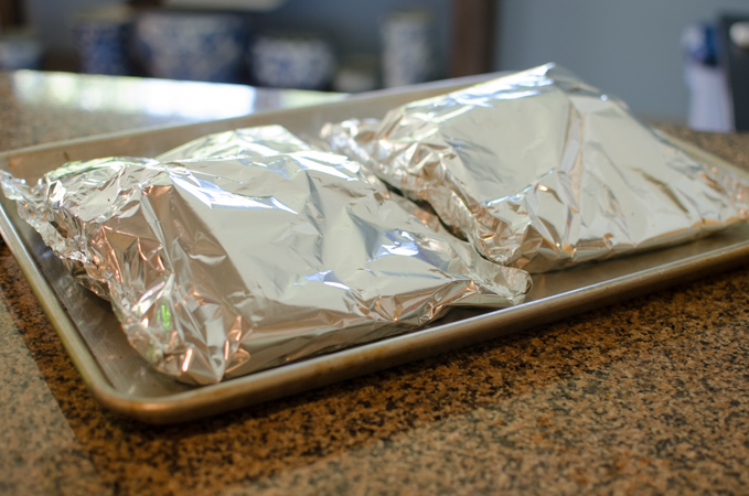 Wrap the pork ribs with foil and put them in the oven to cook.