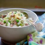 Leftover rice is stir-fried with sausage, peas, and lemon.
