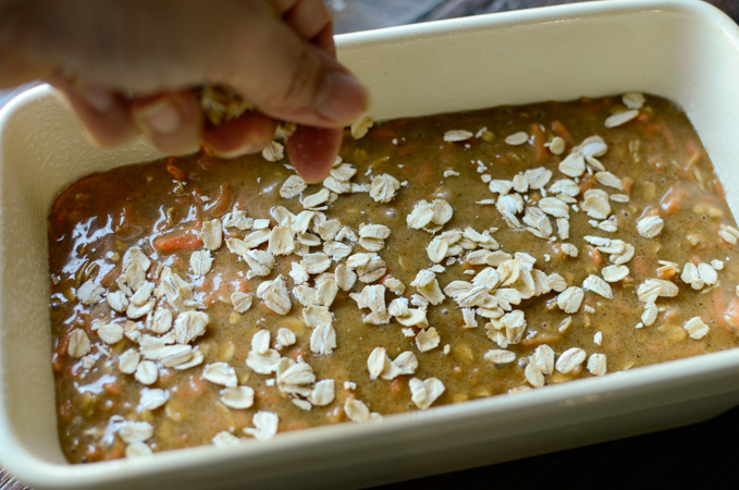 Sprinkle a small amount of oat on top of bread batter as a final touch.