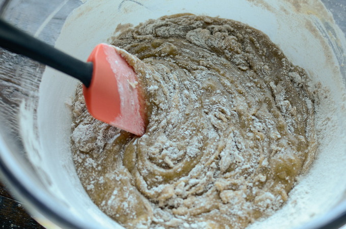 Dry mixture is added to wet ingredients of the oat carrot bread recipe.