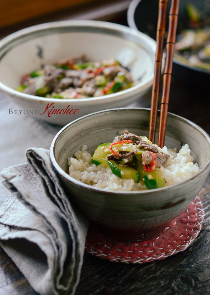 Quick stir-fried beef and cucumber dish is served with rice.