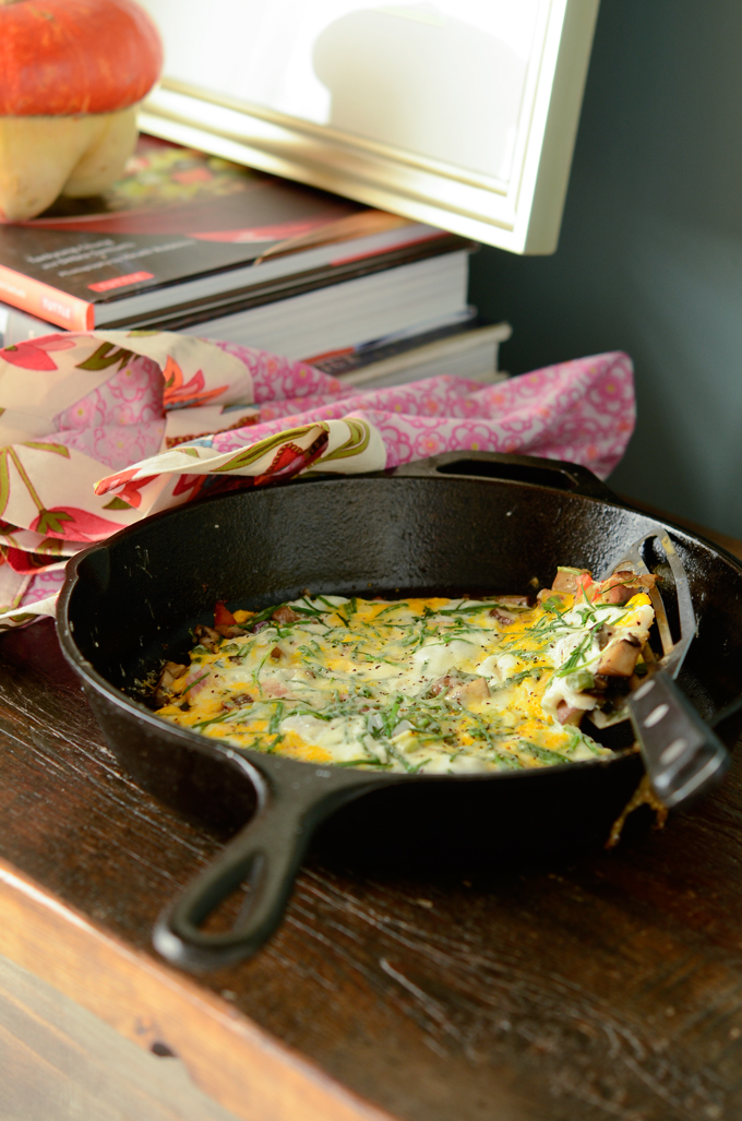 This no-bake vegetable frittata is cooked in an cast iron skillet.