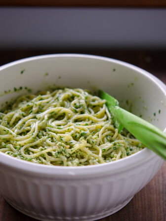 Spaghetti noodles are tossed with Avocado Cilantro Pesto Sauce