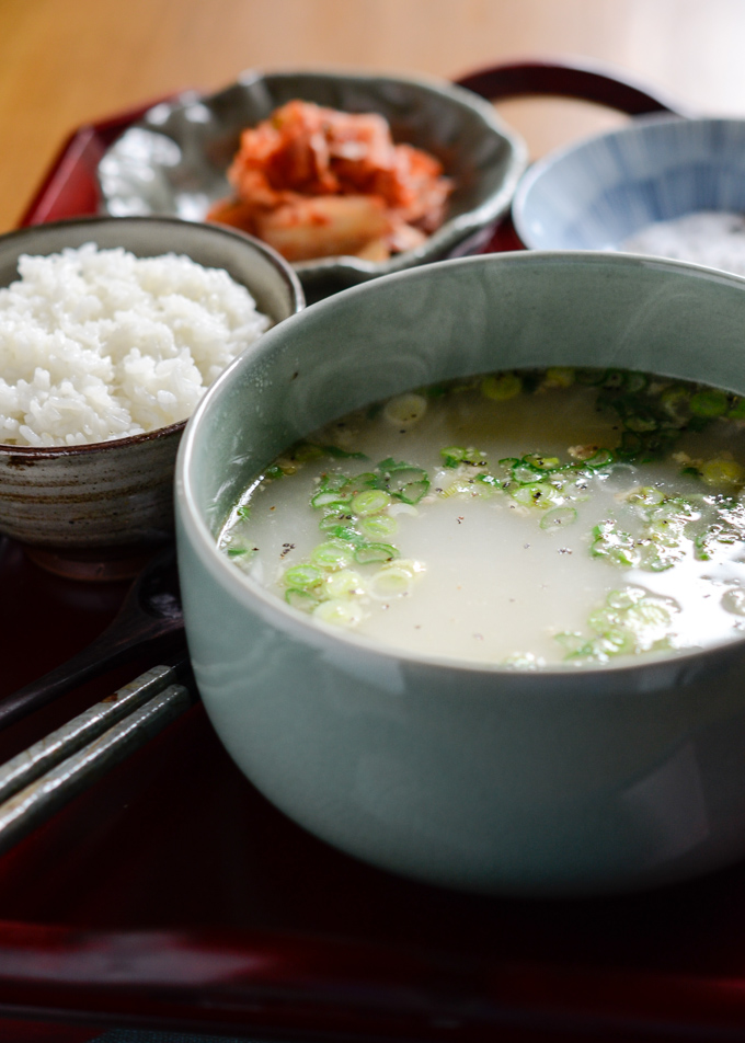 Ox Tail Bone Marrow Soup is served with rice and kimchi.