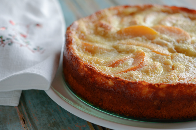 Peach cake has a nice golden brown crust on the side.