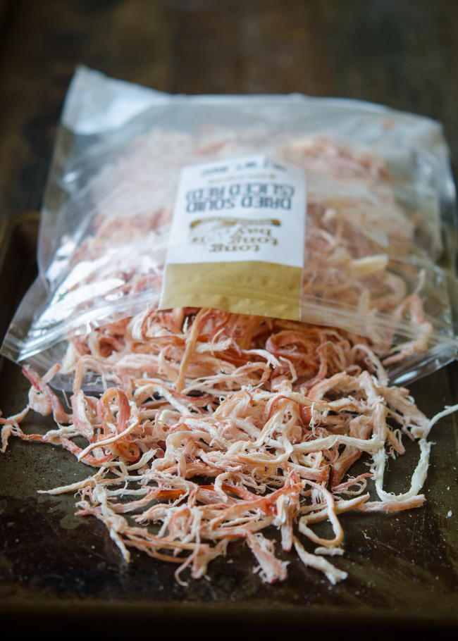 Dried and shredded squid strips are out of plastic package.