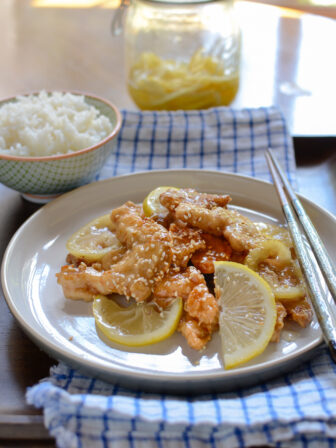Crispy Lemon Chicken is served with fresh slices of lemon