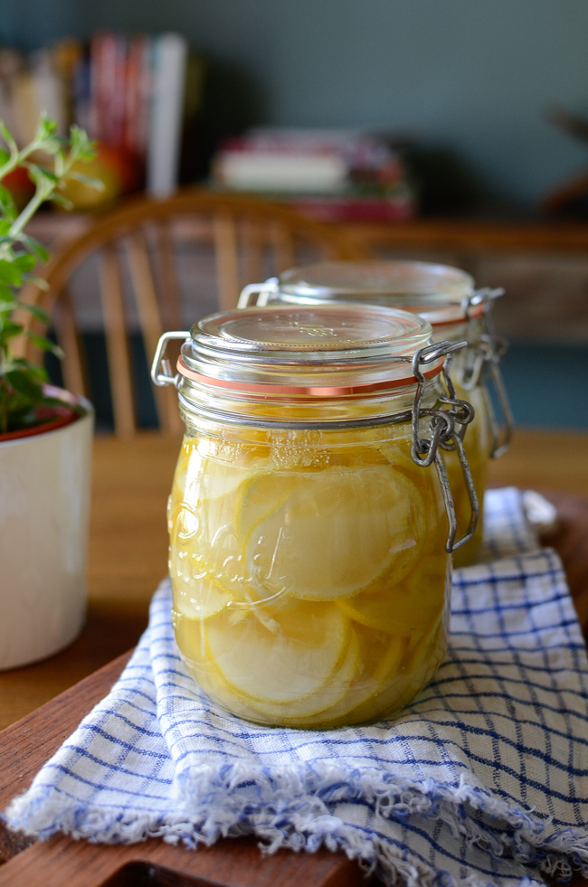 Two jars of Korean lemon syrup are sitting on a kitchen towel.