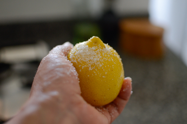 Rubbing the lemon with salt will remove the waxy coating of lemon skin.