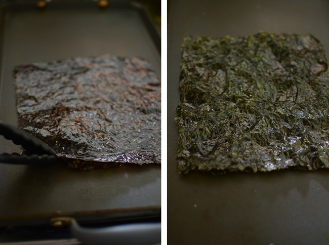 Oiled and seasoned seaweed sheet is roasting in a hot griddle.