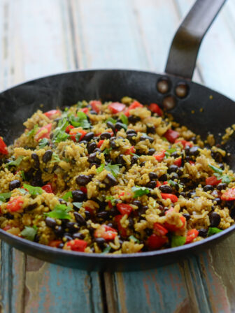 Black Bean Quinoa Curry Rice is cooked in a skillet