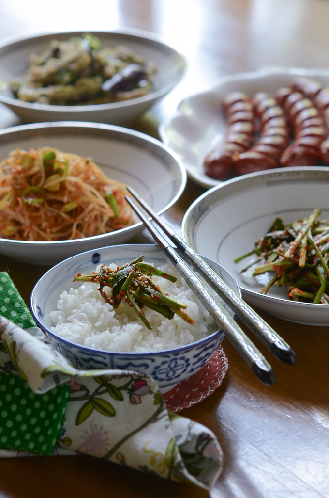 Garlic Chives Kimchi is served with rice and other Korean side dishes