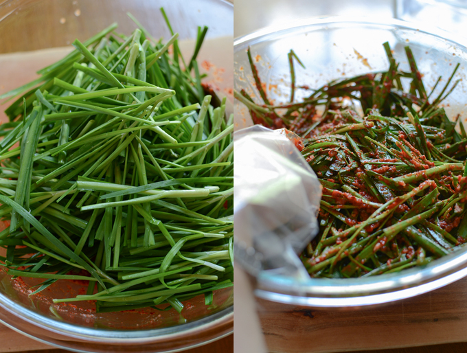 Garlic chives are tossed with kimchi filling.