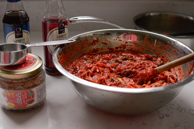 Kimchi paste is mixed in a large bowl.