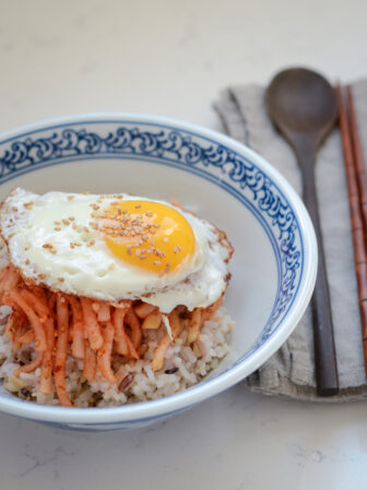 Radish Salad and rice topped with a fried egg makes a quick rice bowl in a hurry.