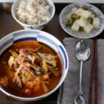 Instant pot beef stew with rice on a serving tray.