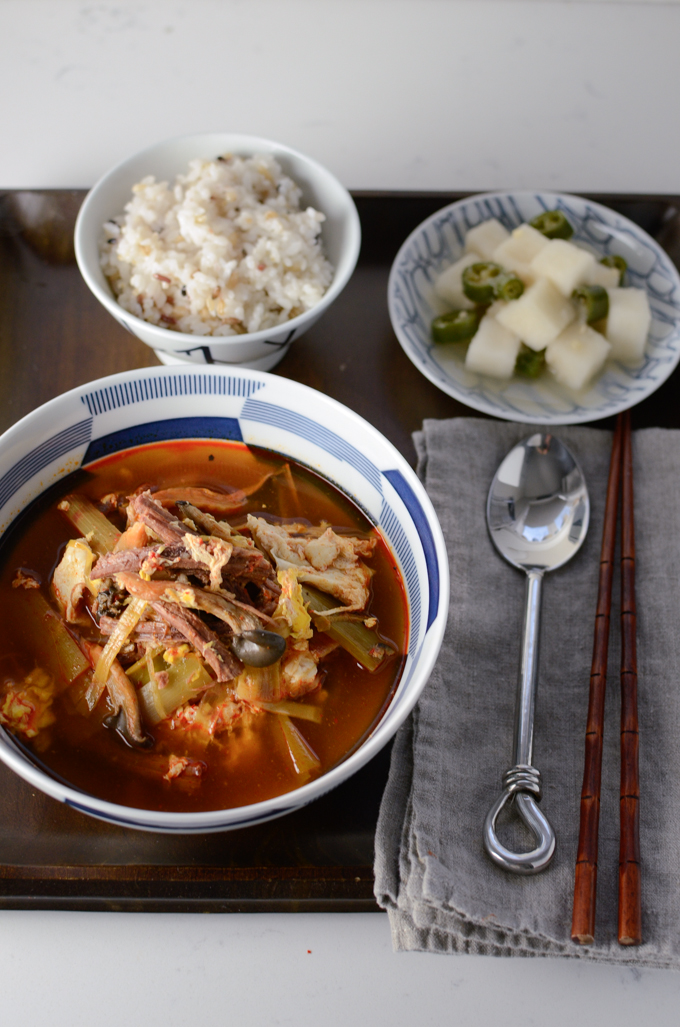 Spicy Korean beef stew is served with rice and side dish.