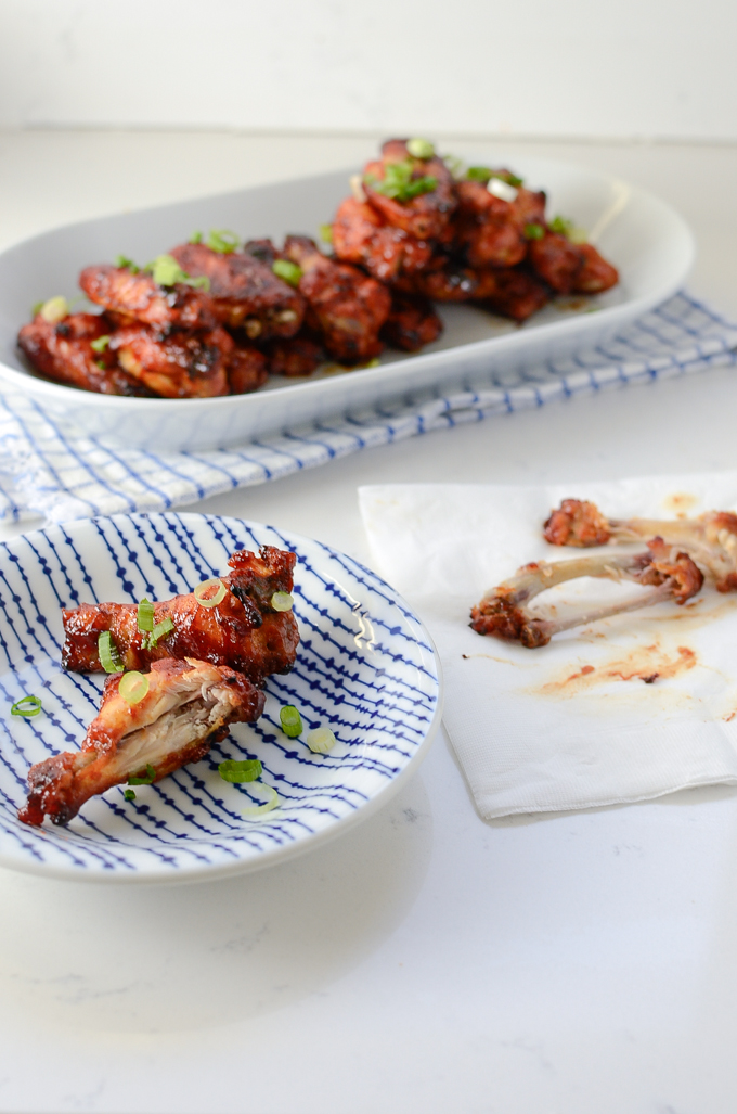 These baked chicken wings are served on a platter and makes a great finger food to munch on.