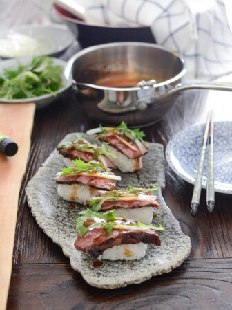 Beef Steak Sushi is adorned with homemade teriyaki sauce.