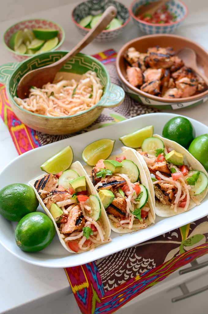 Blackened salmon tacos are served with Korean radish salad and pico de gallo.