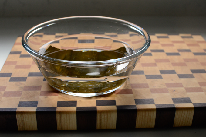 Soaking dried sea kelp in water.