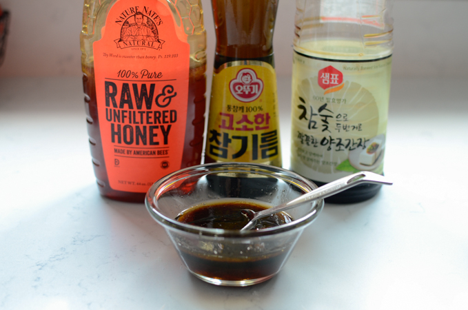Ingredients for honey glaze sauce are mixed in a small bowl.