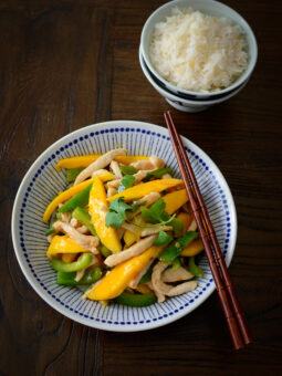 Chicken breast and mango is stir-fried quickly in sweet chili sauce and served with rice.