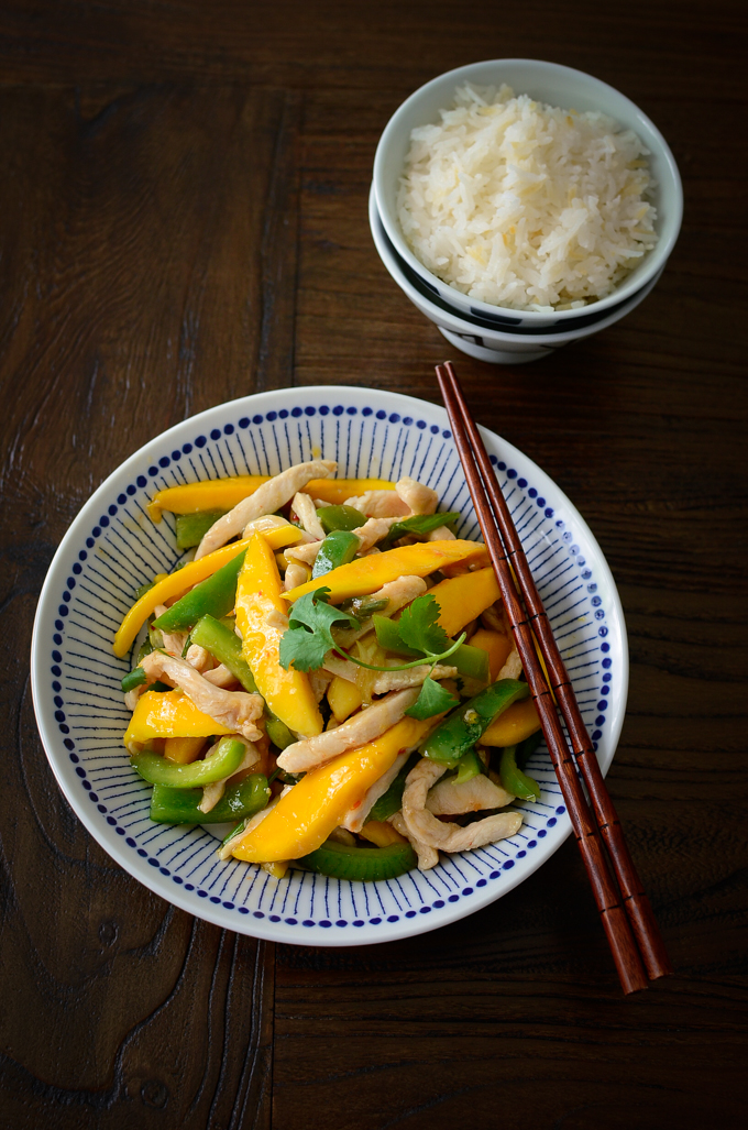 Chicken breast and mango is stir-fried quickly in sweet chili sauce and served with rice.