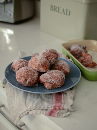 Malasadas is famous Portuguese donuts. Simple yeast dough is deep fried, then coated with sugar.