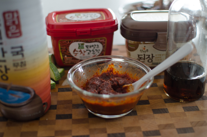 Spicy seasoning paste ingredients are mixed in a small bowl.