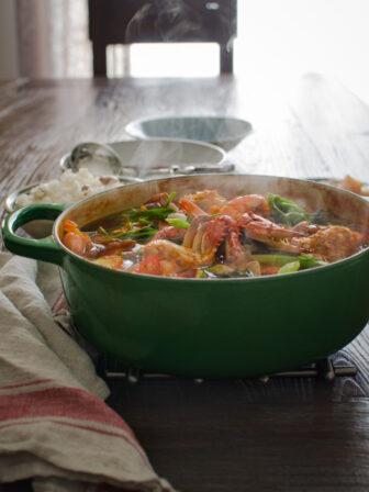 Korean Crab Stew made with fresh crabs and shrimp is steaming hot in a pot.
