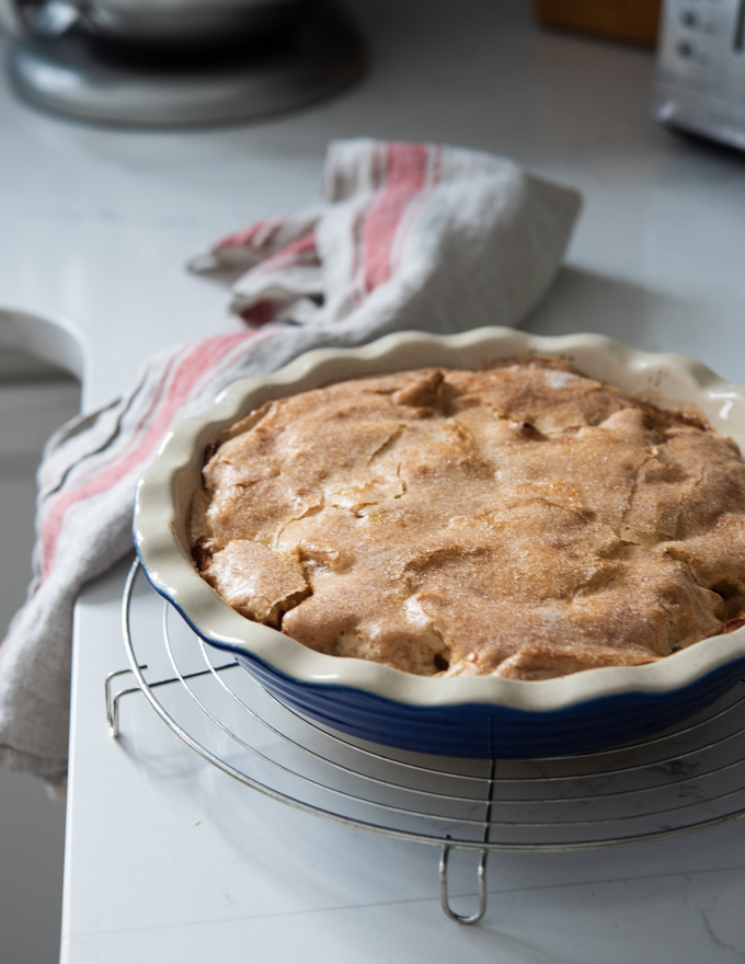 Crustless Swedish apple pie showing its cracked finish on top of pie.