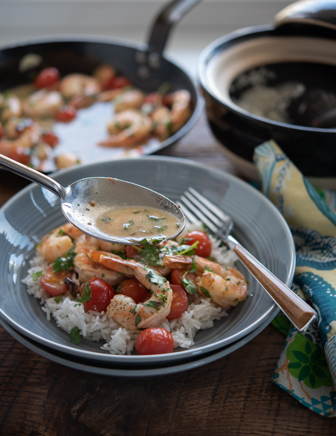 Drizzle lemon butter sauce over shrimp and tomatoes.
