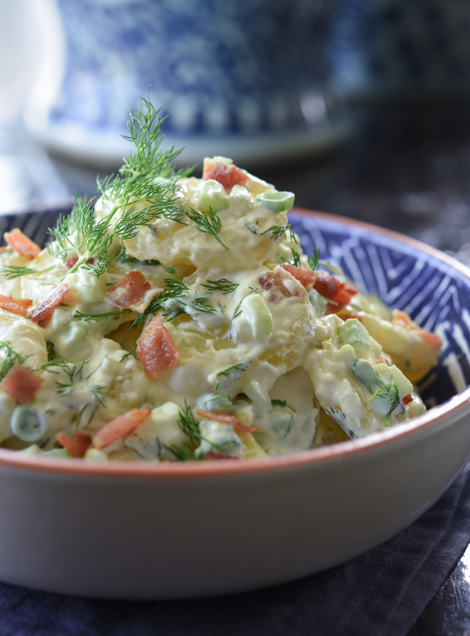 Creamy potato salad dressed with mayo-sour cream dressing and fresh herb